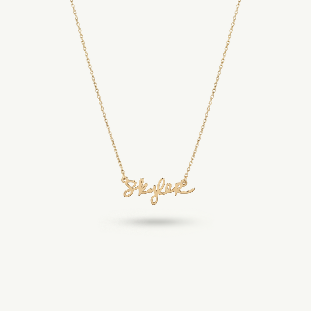Centered view of the Montkai Clairmont necklace in 14k solid gold, showcasing a precise and architectural custom nameplate based on original handwriting.