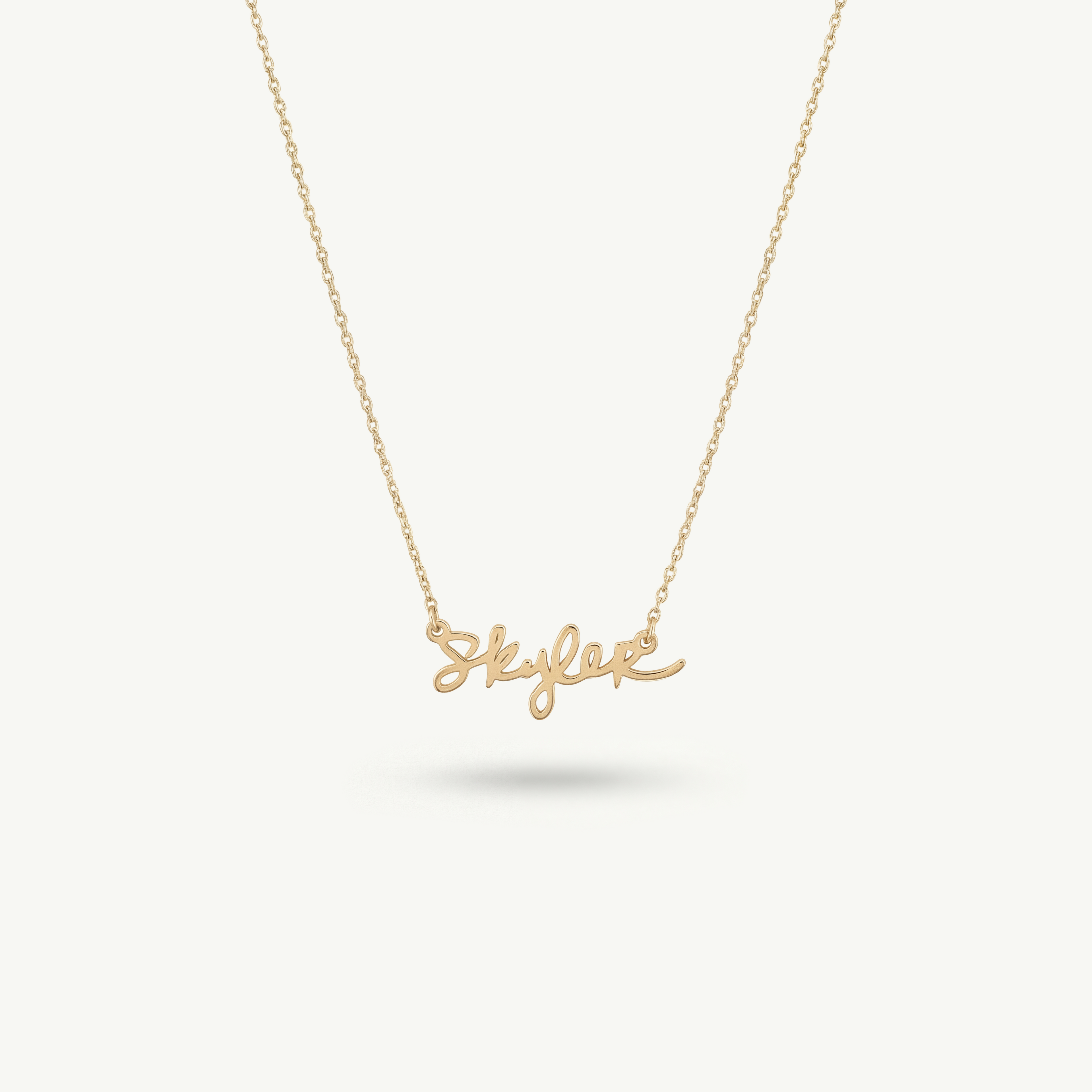 Centered view of the Montkai Clairmont necklace in 14k solid gold, showcasing a precise and architectural custom nameplate based on original handwriting.