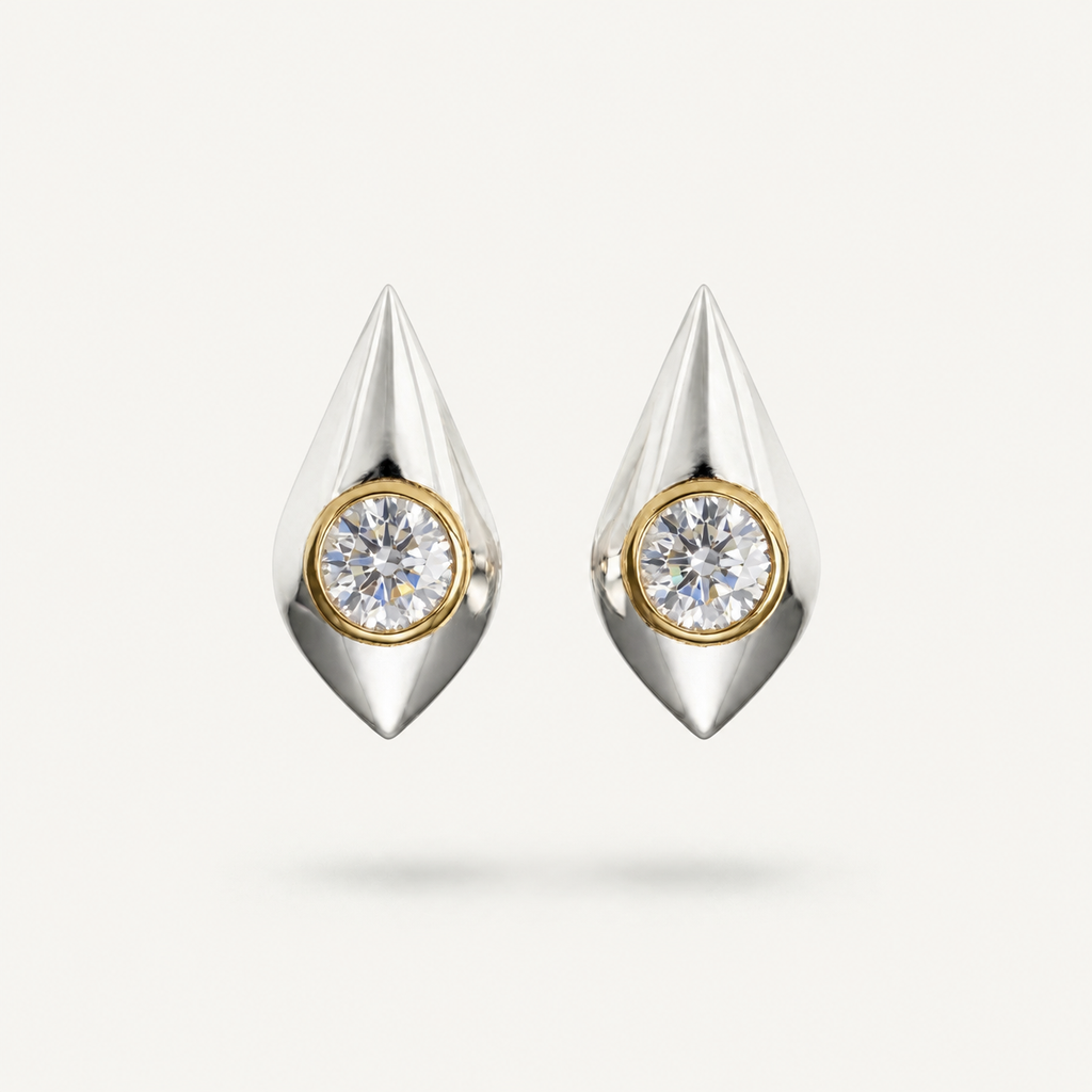 Architectural sterling silver drop earrings with round bezel-set white sapphire stones and gold detailing